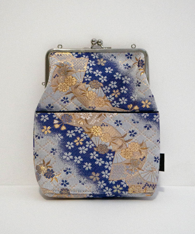 Back view of blue Kinran fabric Japanese shoulder gamaguchi bag with floral and fan design