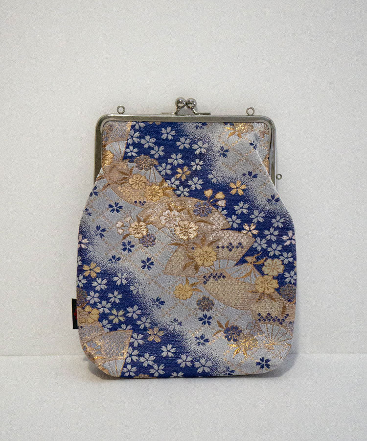Front side of handmade Japanese shoulder clasp bag in blue Kinran brocade with floral and fan motifs