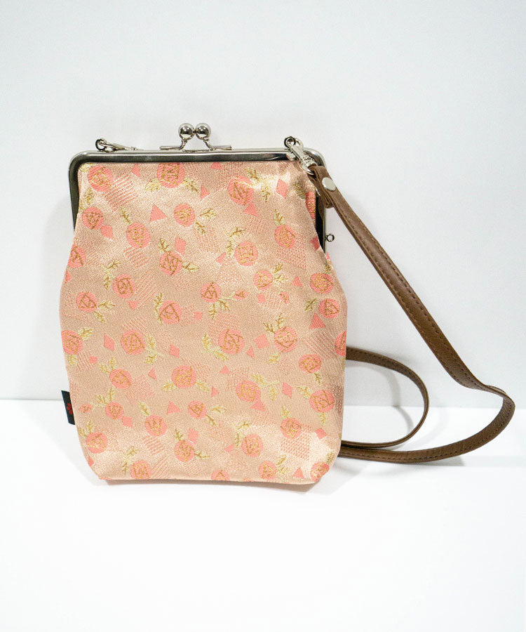 Front view of pink rose Kinran fabric Japanese shoulder gamaguchi bag with strap