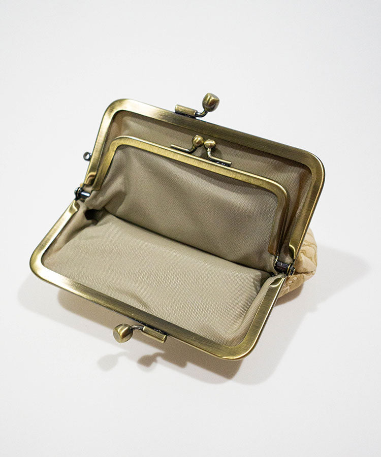 Gold clutch purse on a white background