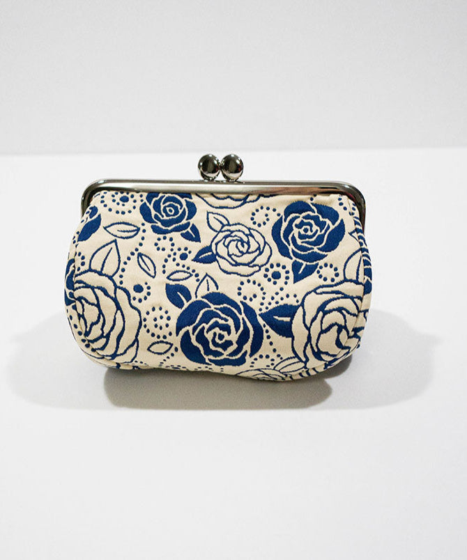 Clutch bag with blue floral pattern on a white background