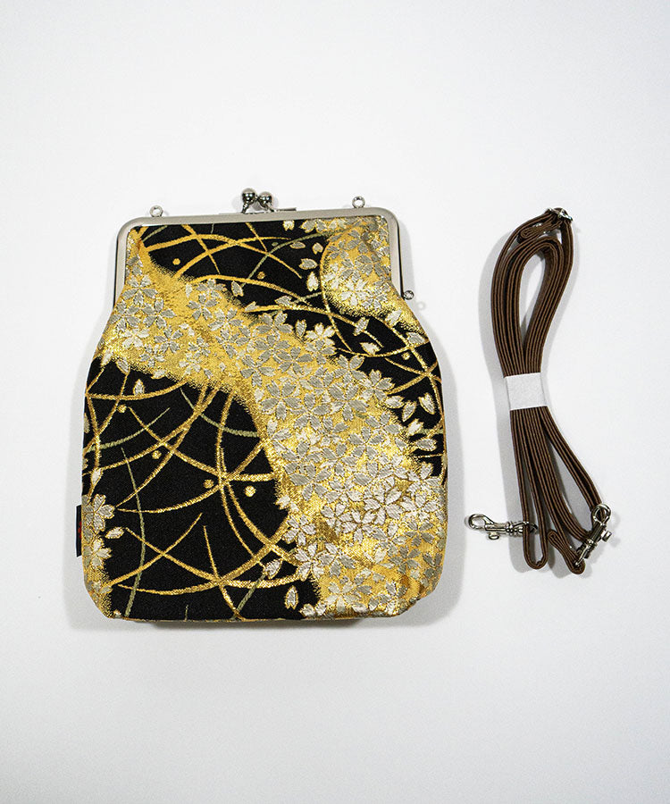 Flat view of handmade Japanese Kinran fabric gamaguchi shoulder bag in black and gold floral design