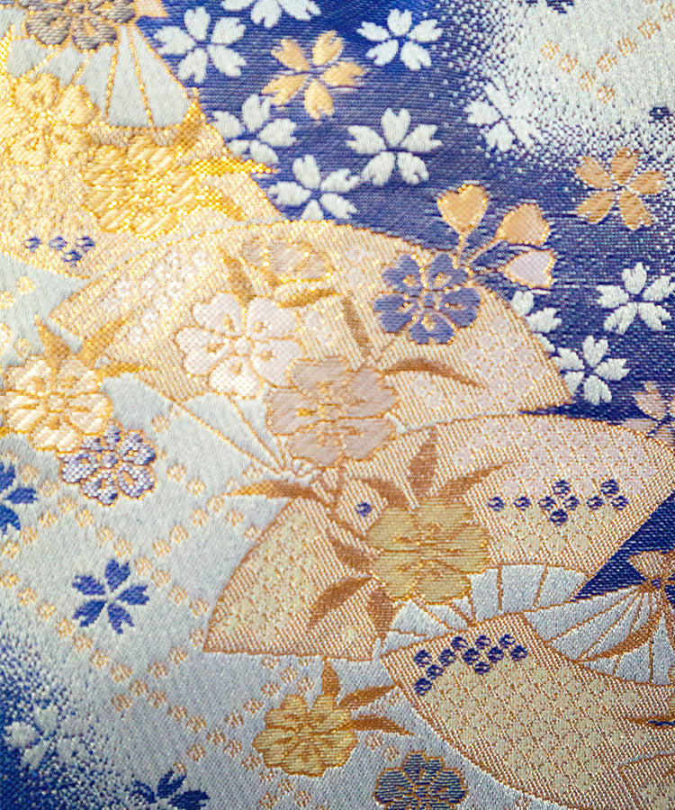 Kyoto-crafted shoulder gamaguchi bag in blue Kinran fabric with gold floral and fan pattern, closeup view